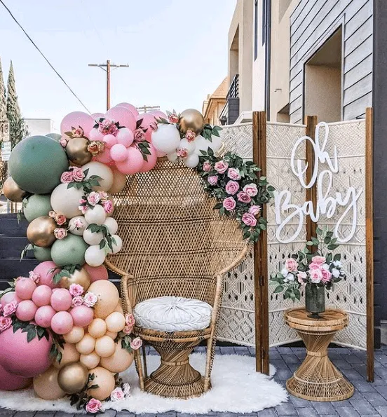 11. Pretty Chair Back Baby Shower Decor — photo inspiration